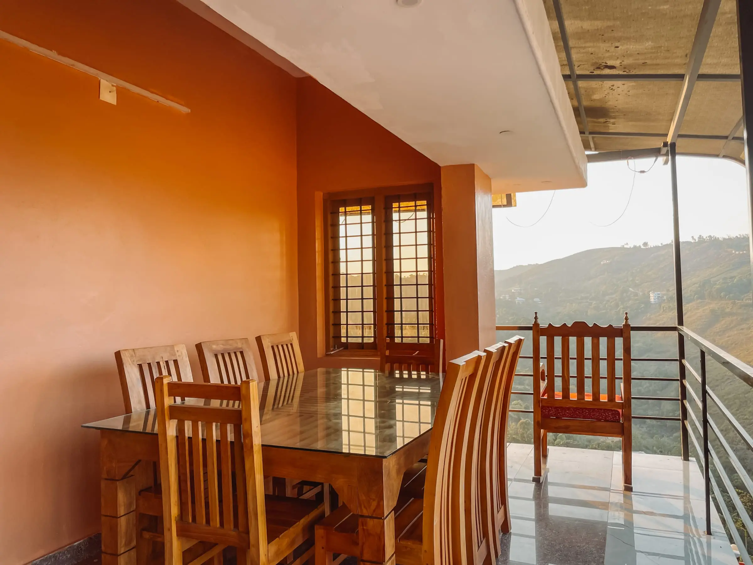 The Spacious Floor: covered balcony dining area facing the valley