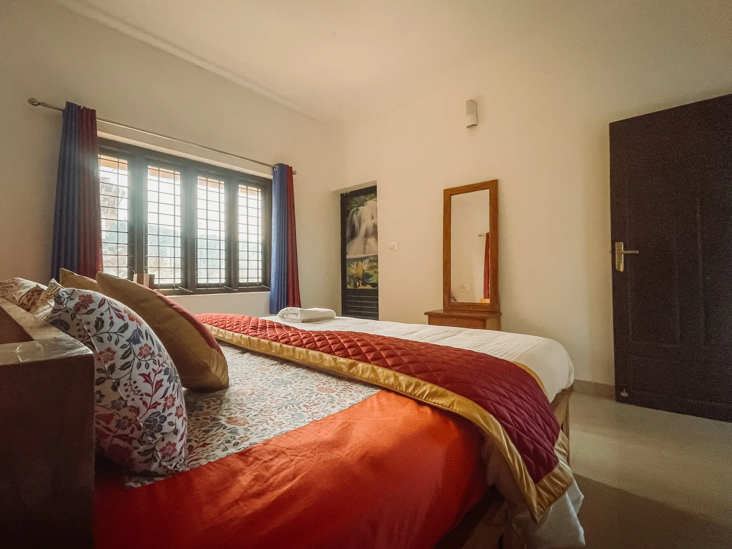 The Comfort Suite: bedroom with morning light across the bed