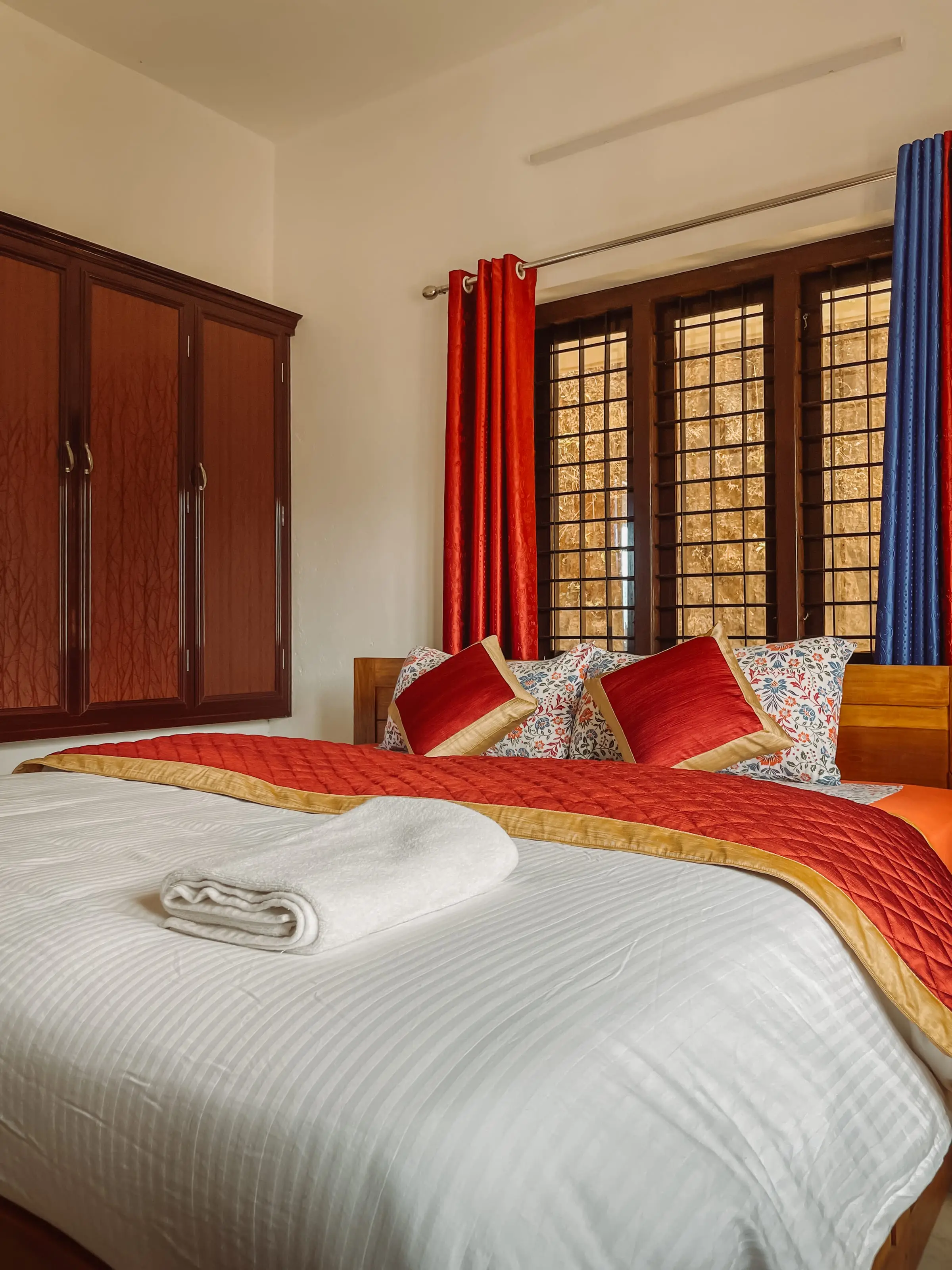 The Comfort Suite: bed beside the bay window
